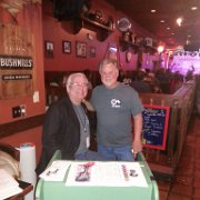(l. to r.) Tom Krebs (Jam4Dam Secretary/Treasurer) and Mike Fox (Jam4Dan President and Celtic Fox Owner) pause for a moment on Friday night to post for a pic.